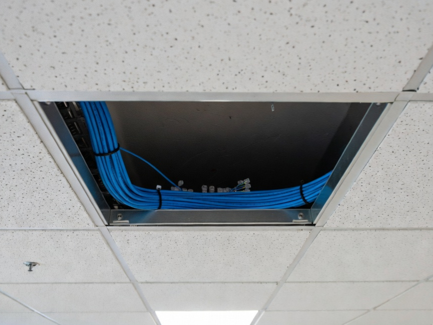 Cat6 plenum cable installation in commercial drop ceiling showing proper CMP fire rating compliance for HVAC air return spaces Cat6 plenum cable installation in commercial drop ceiling showing proper CMP fire rating compliance for HVAC air return spaces